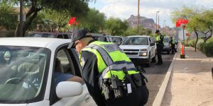 Mesa, Ariz. / US - September 6, 2010: During a joint Labor Day sobriety checkpoint operation, Mesa and Gilbert police officers talk to drivers about the dangers of driving under the influence. 7924