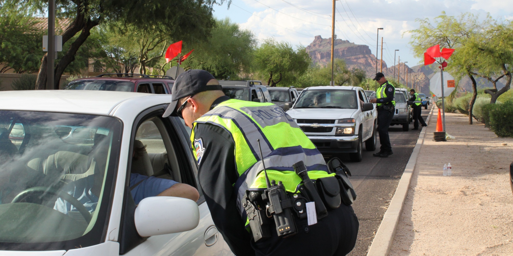 Mesa, Ariz. / US - September 6, 2010: During a joint Labor Day sobriety checkpoint operation, Mesa and Gilbert police officers talk to drivers about the dangers of driving under the influence. 7924