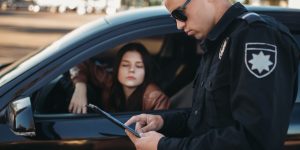 Cop in uniform checks license of female driver